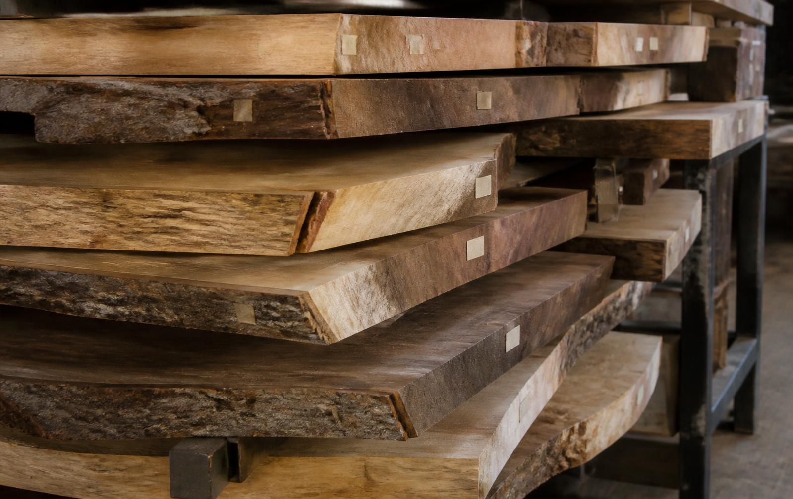 Kiln dried live-edge hardwood slabs ready for woodworking projects